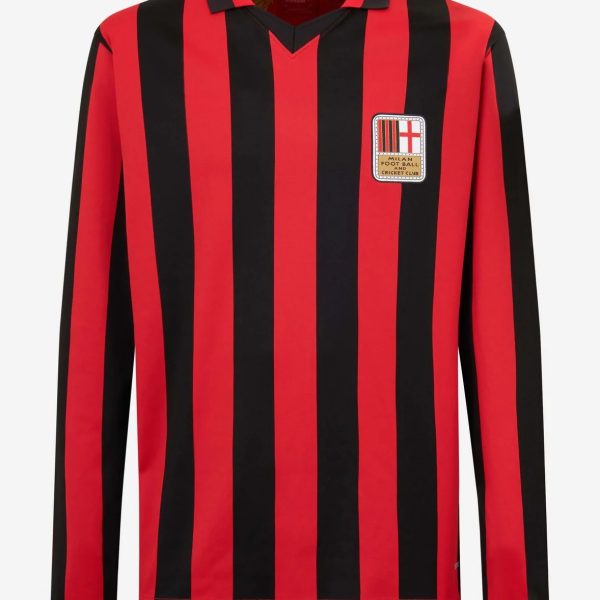 Red and black vertical striped soccer jersey with crest on the chest, likely Milan Football Club badge visible on the front.