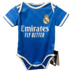 43af72bf-aadd-4c33-835e-52f4dc0a199b | UAE SPORT STORE Blue Real Madrid baby onesie with white trim and crest, featuring the 'Emirates Fly Better' sponsor text at front.
