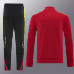 Red athletic tracksuit jacket paired with black track pants featuring yellow and pink side piping, shown from the back/side for a sportswear catalog
