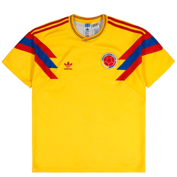 Yellow Colombia national team soccer jersey with diagonal red and blue stripes, featuring the adidas logo and federation crest.