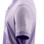 Side view of a lavender purple short-sleeve athletic jersey, sleeve shows a light-colored 'Kissimmee Florida' logo.