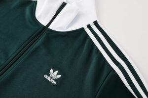 Green Adidas track jacket with white stripes along the sleeves and a zippered front.