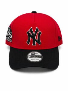 Red Yankees baseball cap with a black brim, large black-and-white NY logo on the front, adjustable.