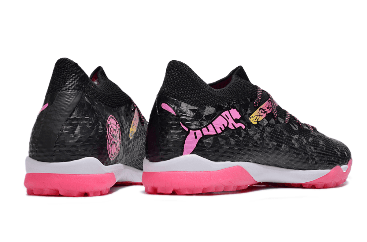 Pair of black athletic sneakers with bright pink soles and pink logo graphics on the sides.