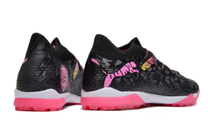46e36a33 | UAE SPORT STORE Pair of black athletic sneakers with bright pink soles and pink logo graphics on the sides.
