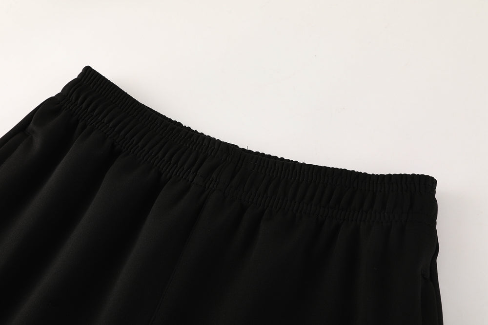 47453367 | UAE SPORT STORE Close-up of black fabric with an elastic waistband, likely athletic shorts or pants.