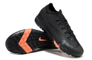 480316fd | UAE SPORT STORE Pair of black Nike Mercurial soccer cleats with orange outsole, shown in an angled side view.