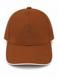 483c02df-7a80-453f-8002-9f959721801d | UAE SPORT STORE Brown baseball cap with an embroidered crest and 'Loro Piana' script on the front panel.