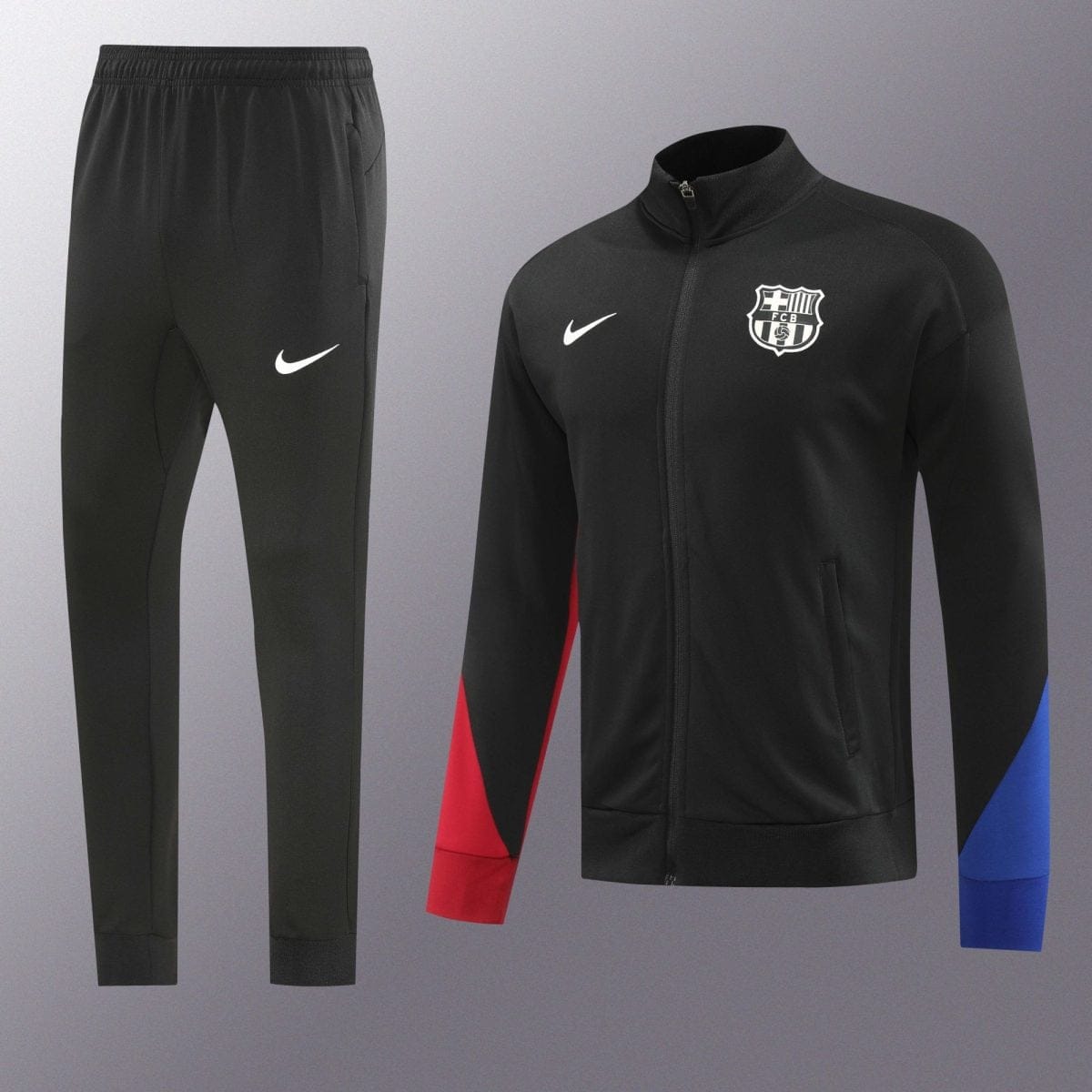 Black tracksuit jacket with FC Barcelona crest and white Nike swoosh, paired with black pants and red/blue side panels.