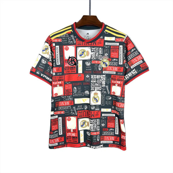Real Madrid football jersey on a wooden hanger with a red, black, white collage pattern and club crest included.