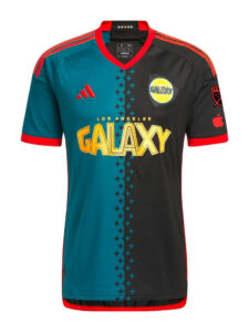 4MIOR6qvESj1is0 | UAE SPORT STORE Split-color LA Galaxy jersey with teal left and black right, bold yellow GALAXY logo, red trim, and sponsor/brand marks on chest and sleeves