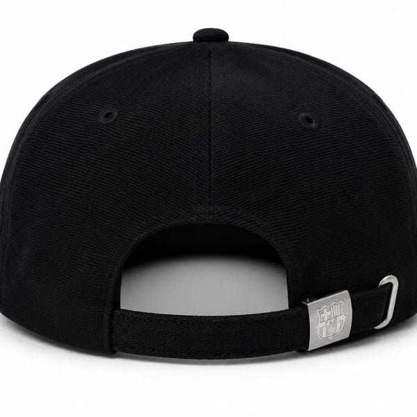 Black baseball cap viewed from the back with an adjustable strap and silver buckle with a crest.