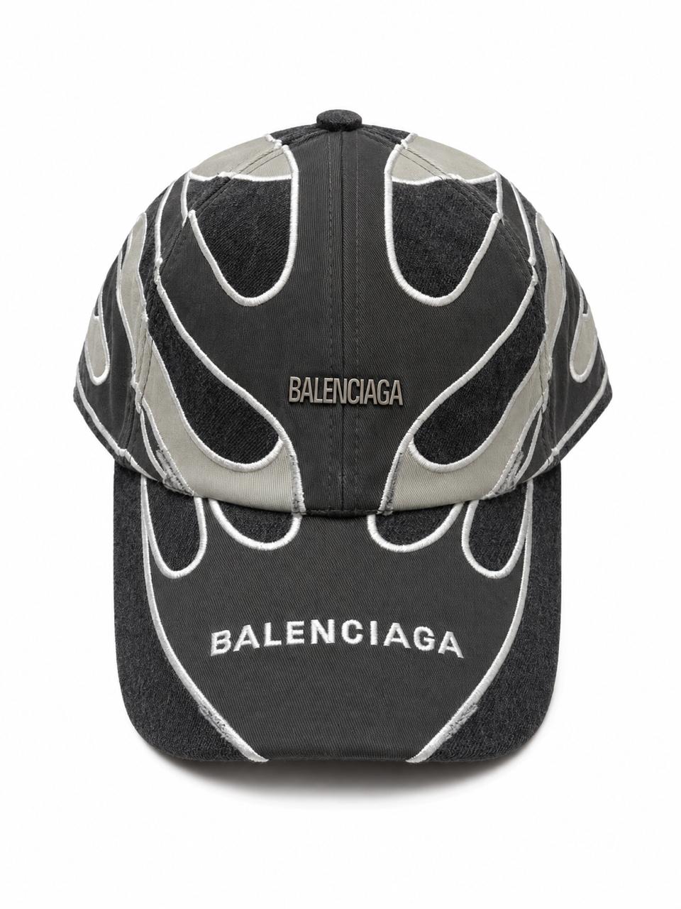4a5374a0-953a-4320-b5e0-5fd0625573fc Black and dark gray Balenciaga baseball cap with white embroidered flame-like seams and the BALENCIAGA logo on the crown.