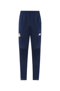 4ae82e80 | UAE SPORT STORE Navy blue Adidas track pants with Real Madrid crest on the left leg and white Adidas logo on the right leg, elastic waistband and tapered ankles.