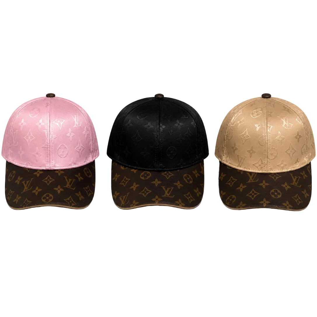 4b1037b6-acd4-4ae8-a856-cb89318ab35a Three Louis Vuitton baseball caps in pink, black, and beige with brown brims and monogram pattern by LV.