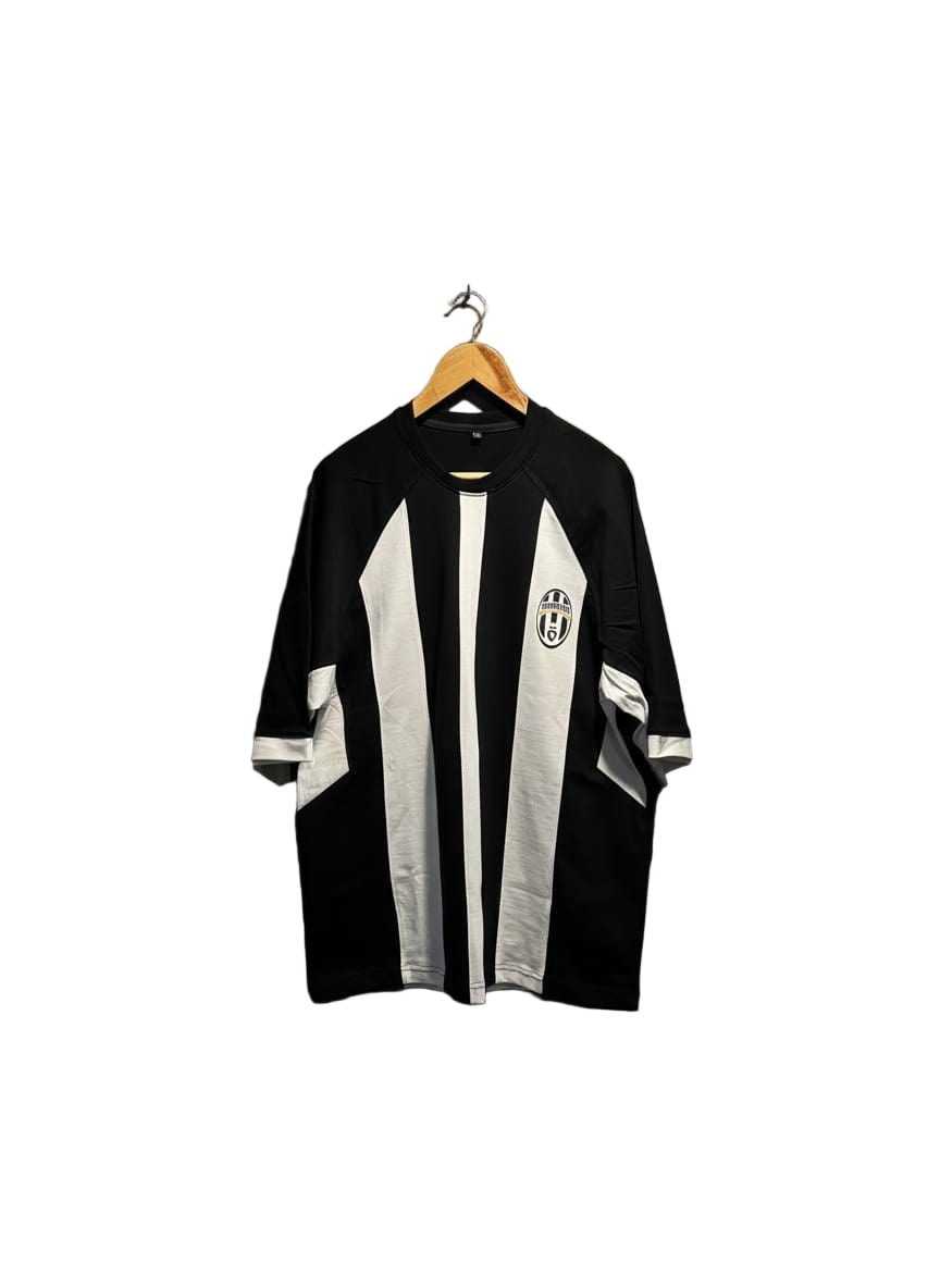 4b76d80a-54e7-45f1-b10f-83de956f98dd | UAE SPORT STORE Black and white striped soccer jersey on a wooden hanger against a white background, with the team crest on the left chest.