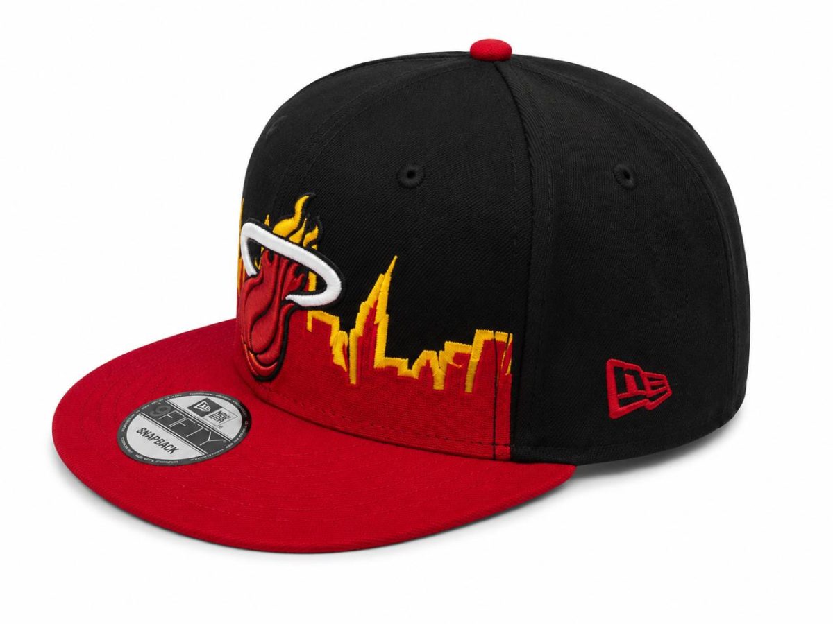 Black and red snapback cap featuring a flaming Miami Heat-style logo on the front panel and a black crown with a red brim; New Era logo on the side.