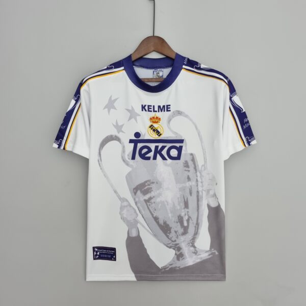 White Real Madrid sports jersey on a wooden hanger, centered on a gray background, featuring TEKA sponsor and crest.