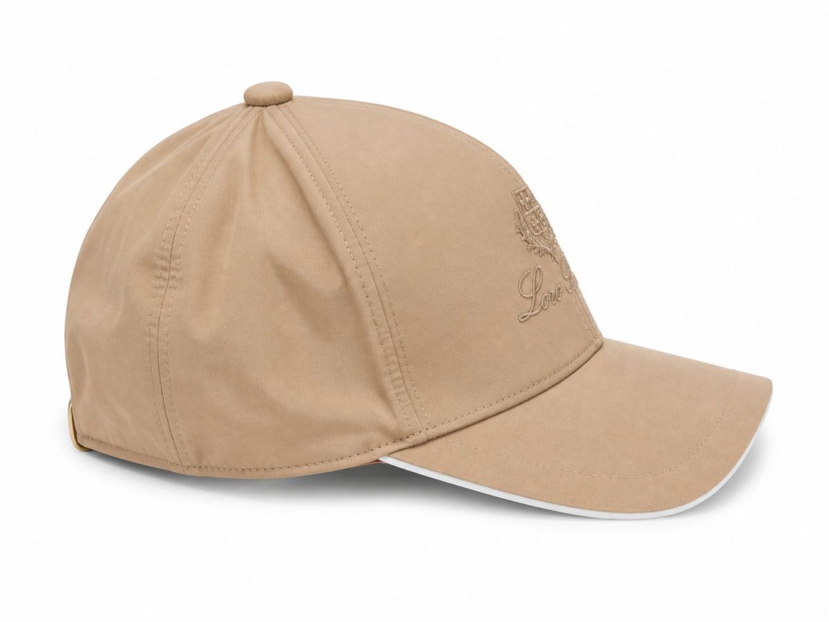 Beige baseball cap with a front crest embroidery and 'Love' script on the front panel