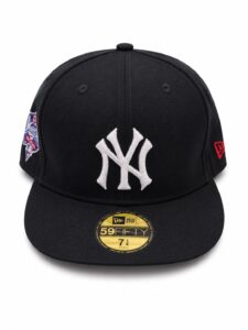 4dcc3cfb-4d18-4c51-b1b3-783915577ebb | UAE SPORT STORE Black fitted cap with white NY Yankees logo, side MLB patch, and red New Era logo on the opposite side; gold 59FIFTY sticker on brim