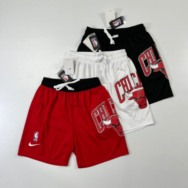Set of three Chicago Bulls basketball shorts in red, white, and black, each with Bulls logo and 'CHI' lettering.