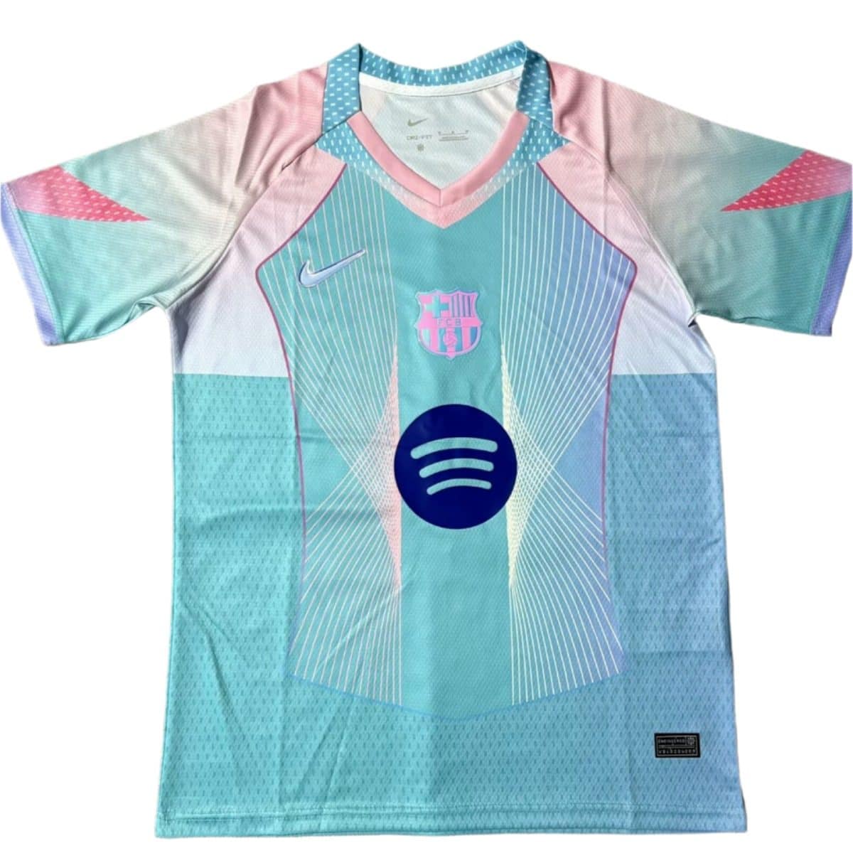 Barcelona FC jersey in pastel teal and pink with Spotify sponsor logo on chest and Barça crest