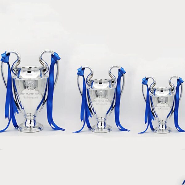 Three silver trophies with blue ribbons arranged in a row on a white background.