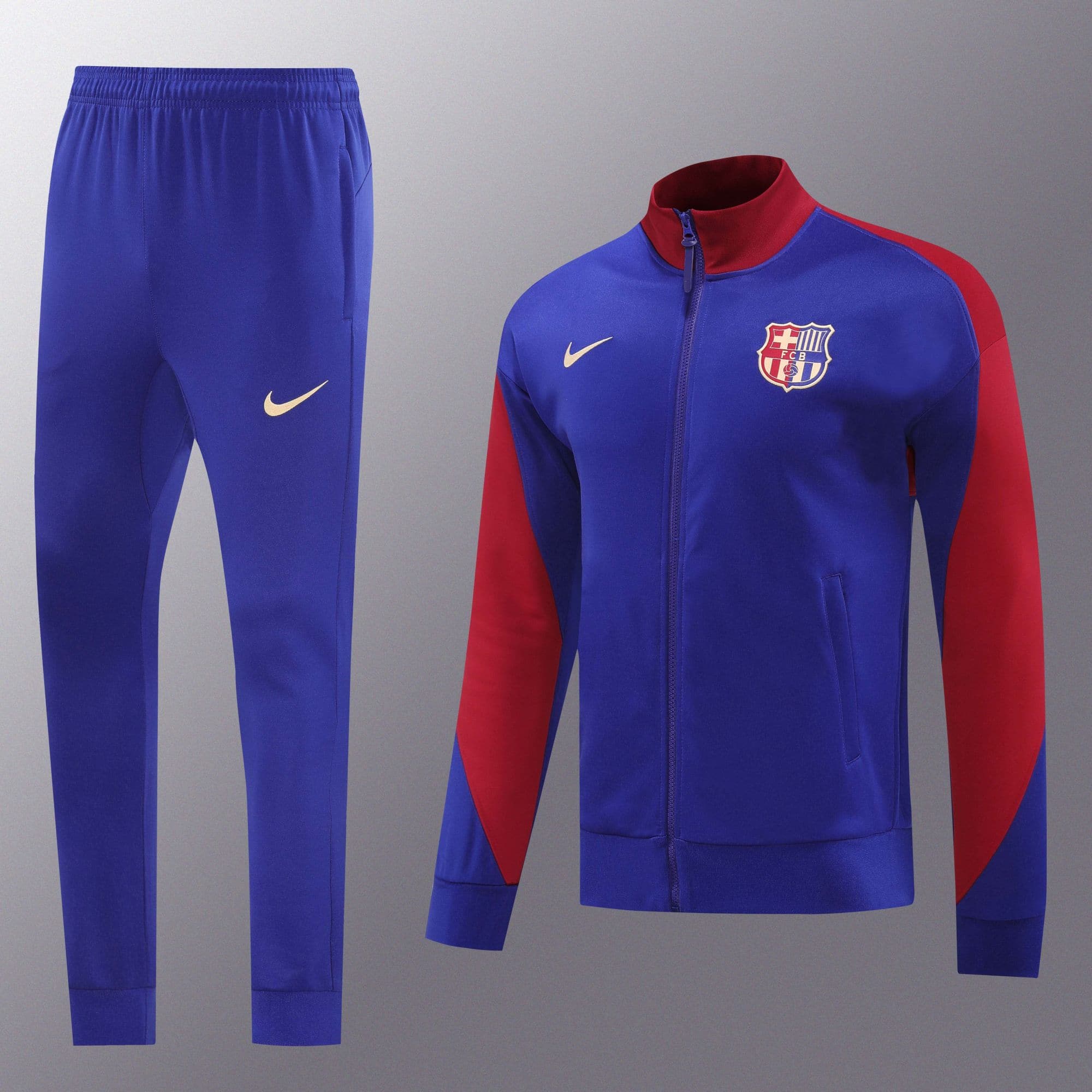 5156b1c1 | UAE SPORT STORE Blue FC Barcelona training tracksuit with red sleeves, shown on a mannequin against a gray background.