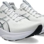 Pair of white running shoes with a thick cushioned midsole and black outsole accents on the toe area.