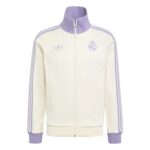Cream-colored full-zip track jacket with lavender collar and striped sleeves; Real Madrid crest and Adidas logo on the chest.