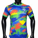 523dff20-6d29-46bd-aa8f-5a113ae20c6e | UAE SPORT STORE Colorful Brazil national team soccer jersey with a splash pattern, crest, and Nike logo.