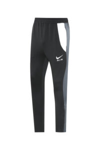 Black Nike Air athletic joggers with a gray side panel and white swoosh logo.