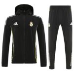 52fccff0 | UAE SPORT STORE Black Real Madrid tracksuit: hooded zip-up jacket with white side stripes and crest, paired with matching black pants featuring neon-yellow piping.