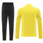 Black athletic pants paired with a bright yellow long-sleeve jacket shown from the back, gym/wear outfit set
