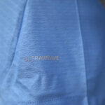 Close-up of blue fabric with the word ULTRAWEAVE printed on it.