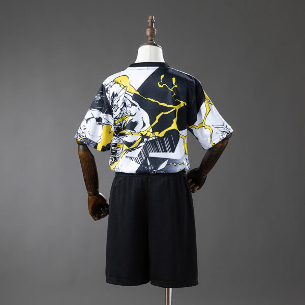 Back view of a mannequin wearing black shorts and a short-sleeve graphic tee with black, white, and yellow abstract design.