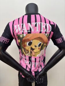 Back view of a pink-and-black striped jersey on a mannequin, featuring a cartoon dog graphic and the word WANTED across the back.