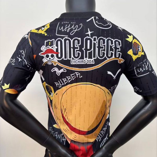 Back view of a mannequin wearing a black One Piece themed jacket with a large hamburger graphic across the back and logo text above it at the center.