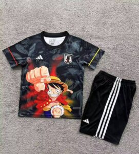 Youth athletic set: black graphic T-shirt with Luffy from One Piece and a Japan badge, paired with black shorts featuring white stripes.