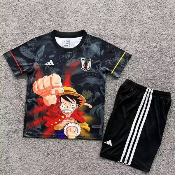 Youth athletic set: black graphic T-shirt with Luffy from One Piece and a Japan badge, paired with black shorts featuring white stripes.