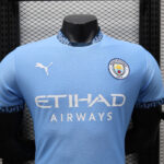 Blue Manchester City football jersey on a mannequin, featuring club crest, Etihad Airways sponsor, and Puma logo.