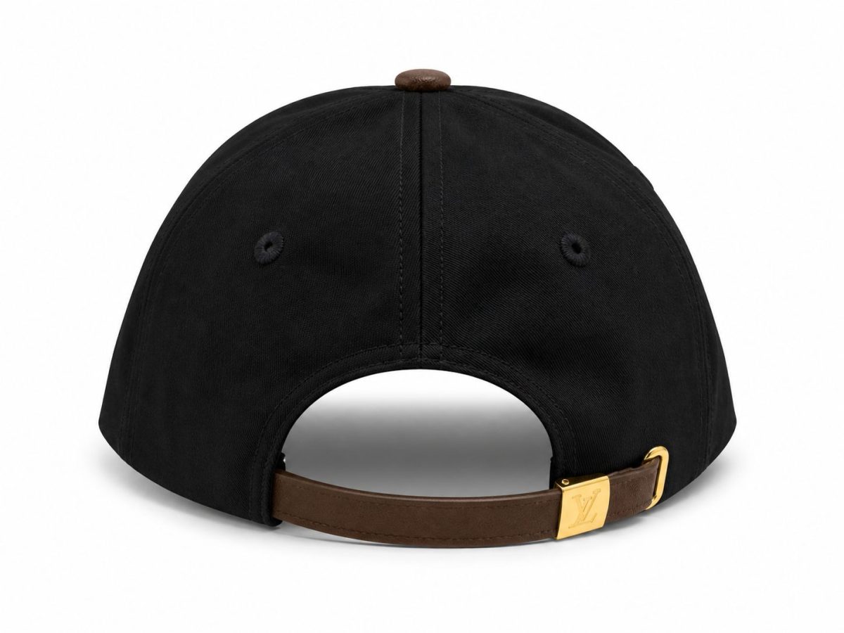 Black cap viewed from the back with a brown leather strap and gold LV buckle. Top button visible on the crown.