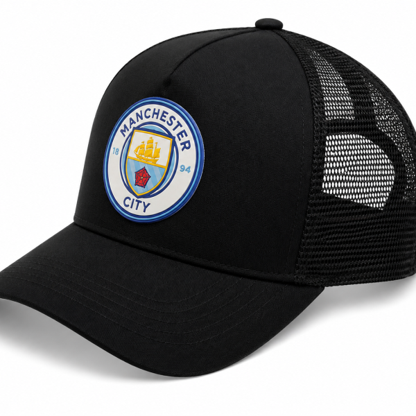 Black trucker cap with a Manchester City crest patch on the front and a mesh back.