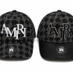 Black Monogram Cap with "AMIRI" logo and floral pattern.