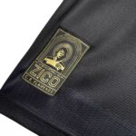 Gold-embroidered patch on black fabric displaying 'ZICO' with a haloed figure and 'CR FLAMENCO' text.