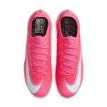 Top-down view of two bright pink athletic sneakers with laces tied, seen from above on a white background.