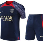 Paris Saint‑Germain navy football jersey and shorts with red accents, prominent Qatar Airways sponsor and Nike logo.