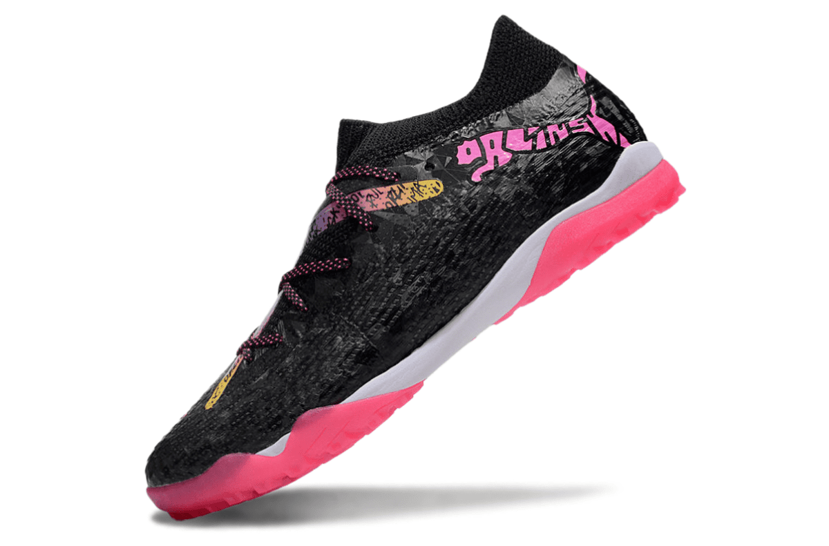 Black athletic shoe with bright pink outsole and pink laces, angled to show side profile.