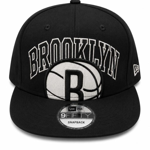 Black snapback cap featuring 'BROOKLYN' embroidery across the front and a basketball patch with a bold 'B' logo, New Era 9FIFTY label visible on brim edge, snapback closure likely behind.