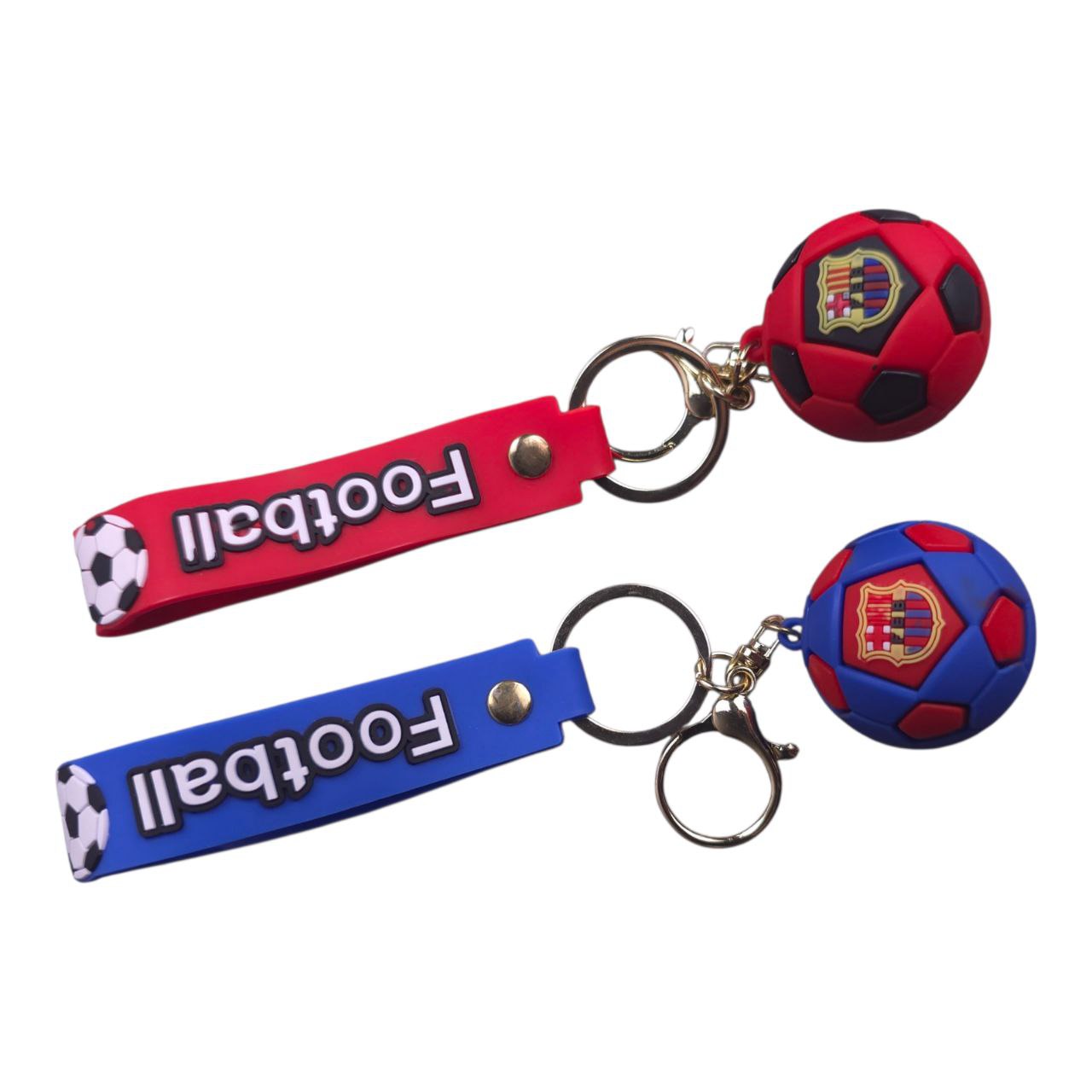 5805548633519671587 | UAE SPORT STORE Red and blue football-themed keychains with soccer ball charms and 'Football' text on straps, set of two.